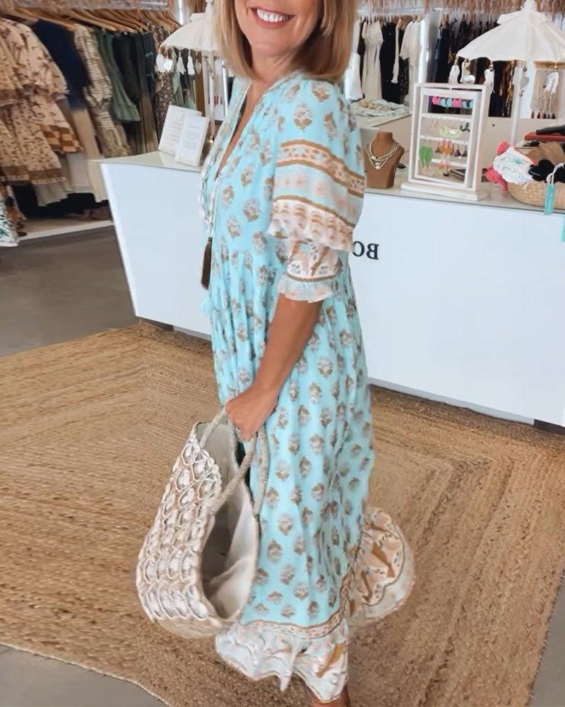Mana | Abito midi chic a fiori con scollo a V