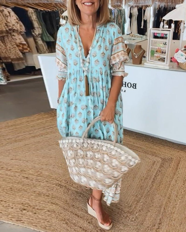Mana | Abito midi chic a fiori con scollo a V