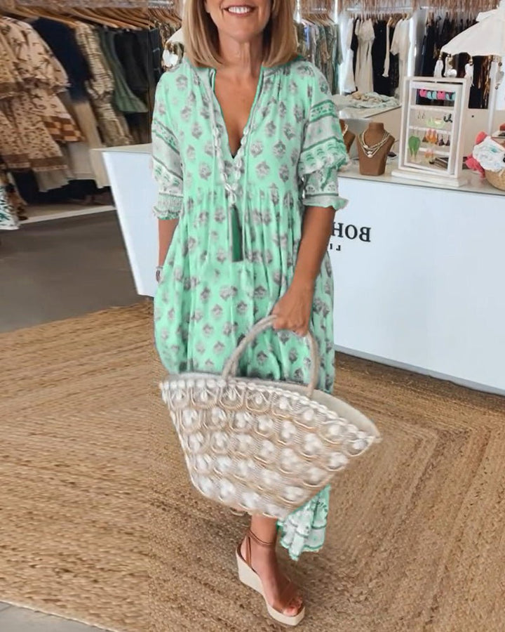 Mana | Abito midi chic a fiori con scollo a V