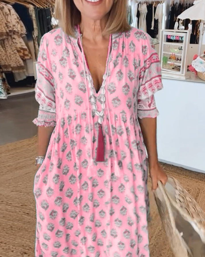 Mana | Abito midi chic a fiori con scollo a V