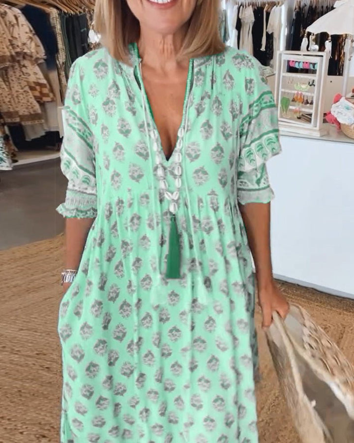 Mana | Abito midi chic a fiori con scollo a V