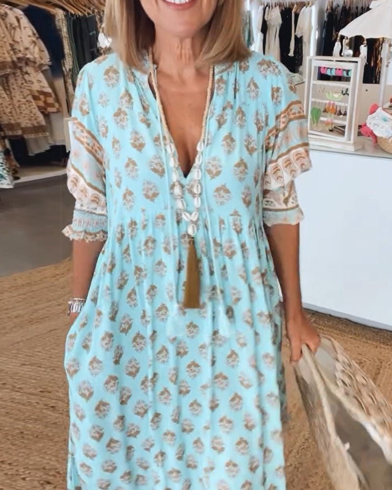 Mana | Abito midi chic a fiori con scollo a V
